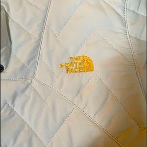 Beautiful white Northface with vibrant yellow trim